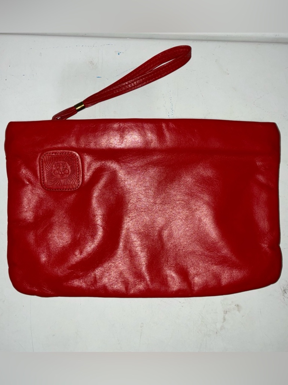 Ann Klein-VTG Red Leather Clutch purse wrist strap zipper closure Apx 11x7” 80s
